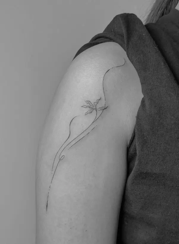 Minimal single line botanical flower stem tattoo by Chelsea.Q